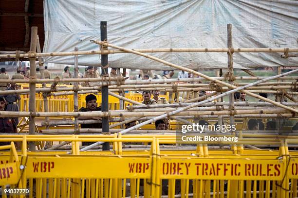 Police guard the heavily barricaded front entrance to the unfinished Tata Nano plant in Singur, India, on Tuesday, Aug. 26, 2008. West Bengal Chief...