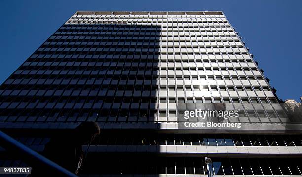 Pedestrian passes in front of the Reserve Bank of Australia building in Sydney, Australia, on Tuesday, Sept. 2, 2008. Australia's central bank cut...