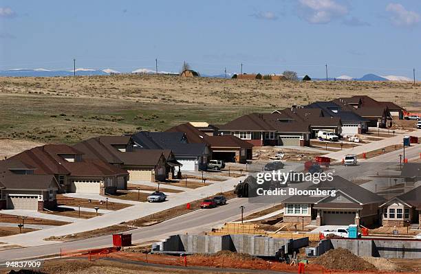 Development of new homes, many of which have already been purchased, is seen while workers continue building around them in the Heritage Eagle Bend...