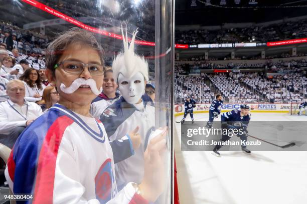 Winnipeg Jets fans watch the pre-game warm up prior to NHL action between the Jets and the Minnesota Wild in Game Two of the Western Conference First...