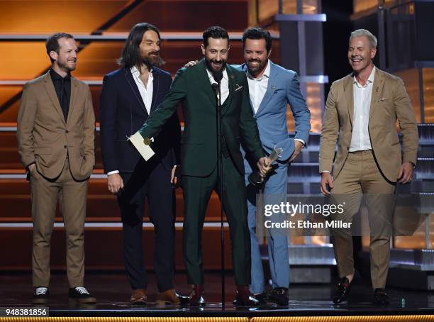 Whit Sellers, Geoff Sprung, Matthew Ramsey, Brad Tursi and Trevor Rosen of musical group Old Dominion accept the Vocal Group of the Year award during...