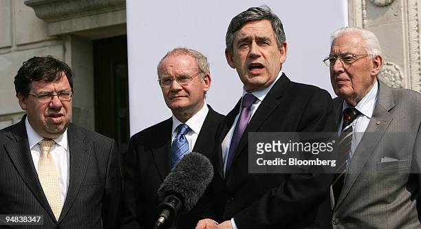 Gordon Brown, second right, Britain's prime minister, speaks alongside Brian Cowen, left, Ireland's new prime minister, Martin McGuinness, second...