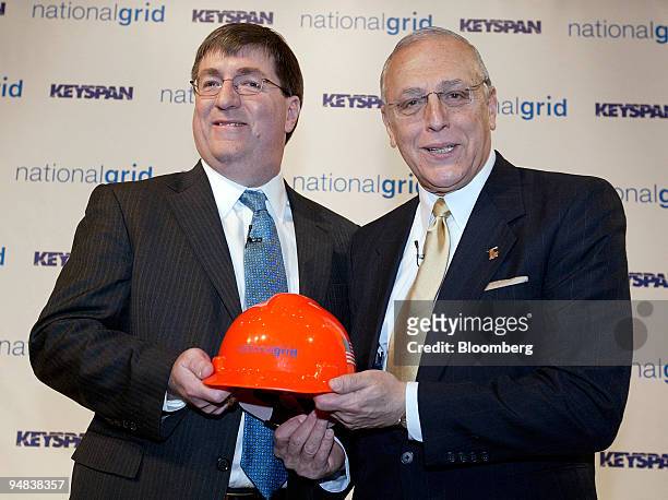 Michael Jesanis, president and COO of National Grid USA, left, poses with Robert Catell, chairman and chief executive officer of KeySpan Corp.,...