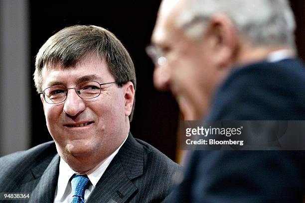 Michael Jesanis, president and COO of National Grid USA, left, smiles at Robert Catell, chairman and chief executive officer of KeySpan Corp., during...