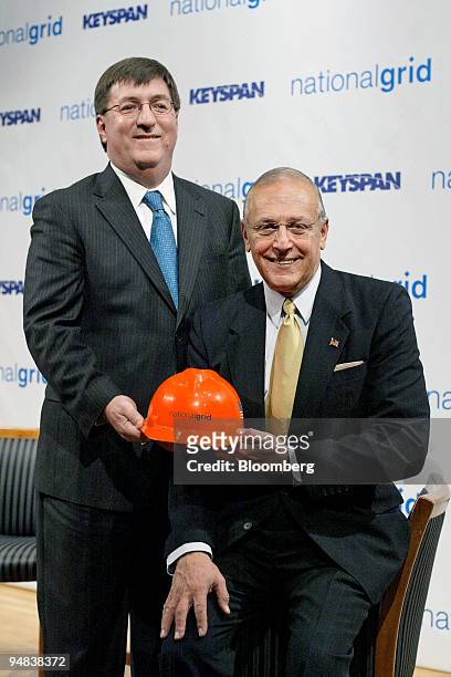 Michael Jesanis, president and COO of National Grid USA, left, poses with Robert Catell, chairman and chief executive officer of KeySpan Corp.,...