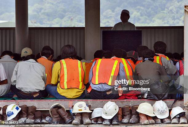Newmont Nusa Tenggara's Muslim workers attend Friday prayers at a makeshift mosque on the edge of the company's Batu Hijau mining pit in the...
