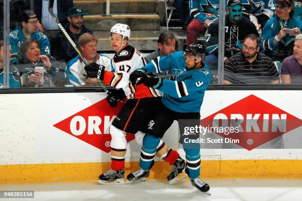 Evander Kane of the San Jose Sharks checks Hampus Lindholm of the Anaheim Ducks in Game Four of the Western Conference First Round during the 2018...