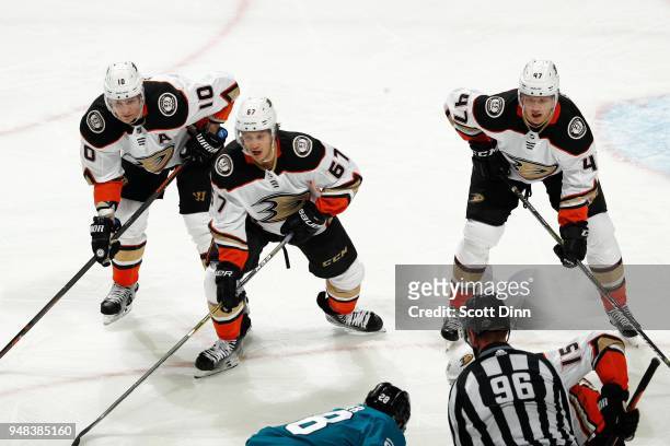 Corey Perry, Rickard Rakell and Hampus Lindholm of the Anaheim Ducks get ready in Game Four of the Western Conference First Round against the San...
