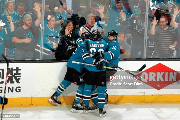 Marcus Sorensen of the San Jose Sharks celebrates his first period goal against the Anaheim Ducks with teammates Paul Martin, Melker Karlsson and...