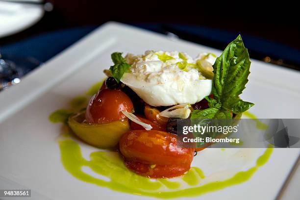 The tomato salad is arranged for a photo at Allegretti, a restaurant located at 46 West 22nd Street in New York, U.S., on Friday, Oct. 3, 2008. Chef...