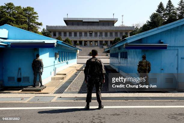 South Korean soldiers stand guard at the border village of Panmunjom between South and North Korea at the Demilitarized Zone on April 18, 2018 in...