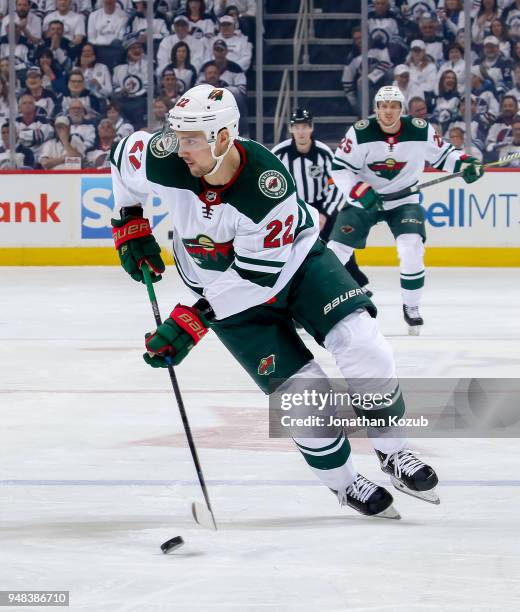 Nino Niederreiter of the Minnesota Wild plays the puck down the ice during first period action against the Winnipeg Jets in Game Two of the Western...