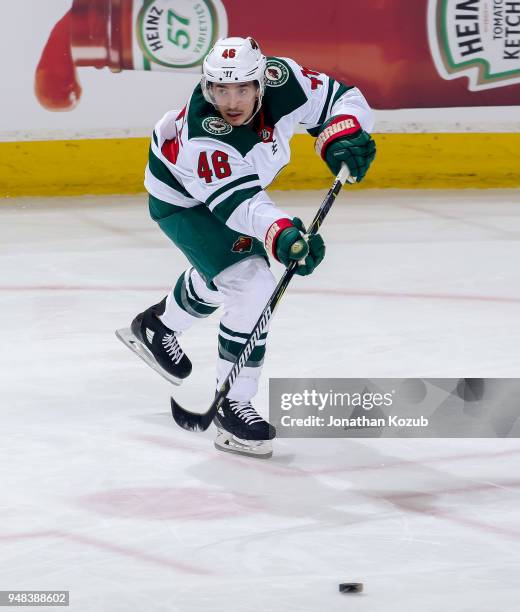 Jared Spurgeon of the Minnesota Wild makes a pass up ice during second period action against the Winnipeg Jets in Game Two of the Western Conference...