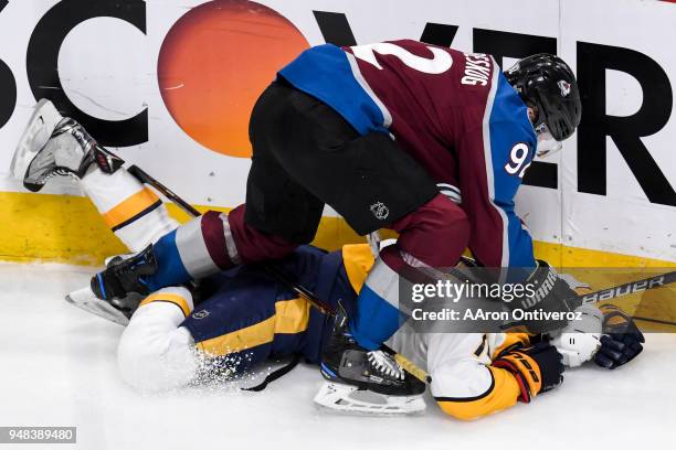 Gabriel Landeskog of the Colorado Avalanche gives Mattias Ekholm of the Nashville Predators the business after Ekholm was called for slashing during...