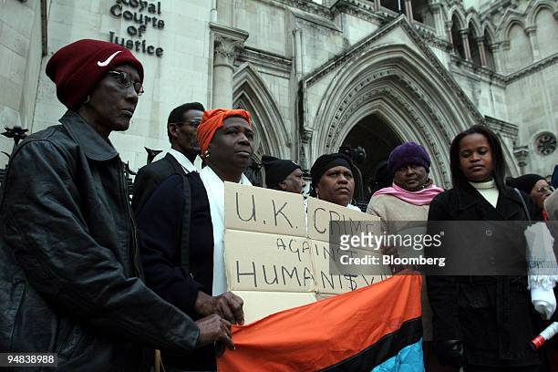 Diego Garcia islanders pose outside the High Court in London, Tuesday, December 6, 2005. The islanders are challenging a decision last year by Prime...
