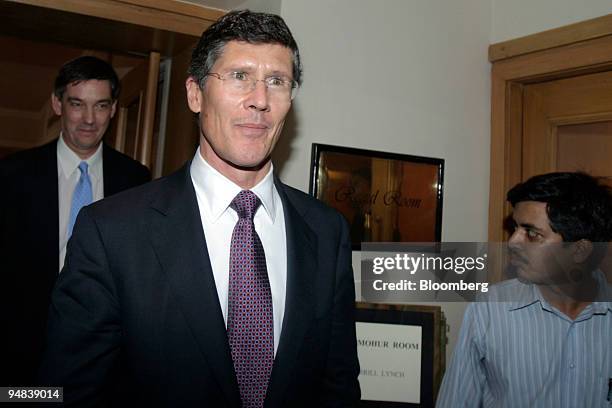 John Thain, center, chief executive officer of Merrill Lynch & Co.,?leaves a press conference in Mumbai, India, on Wednesday, May 7, 2008. Merrill...