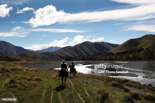 Jan Haslam and Joy Bell take in the scenery on their Arabs while horse riding at Blue Mountain Station on April 3, 2018 in Fairlie, New Zealand. The...