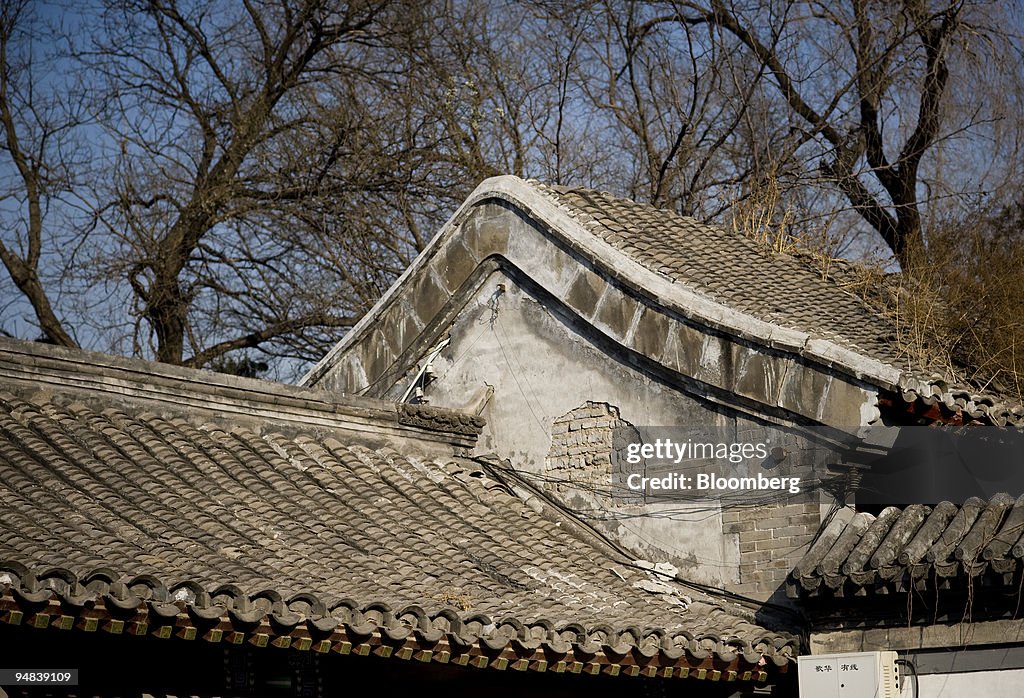 Weeds grow on the roof of a structure inside the Keyuan Gard