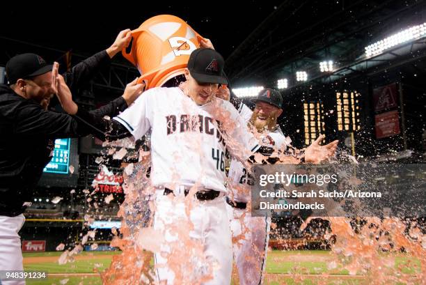 Starting pitcher Patrick Corbin of the Arizona Diamondbacks gets doused in Gatorade after pitching a complete game shutout against the San Francisco...