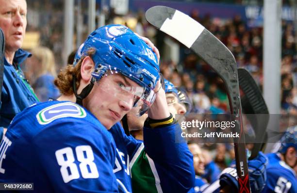 Adam Gaudette of the Vancouver Canucks looks on from the bench during their NHL game against the Columbus Blue Jackets at Rogers Arena March 31, 2018...