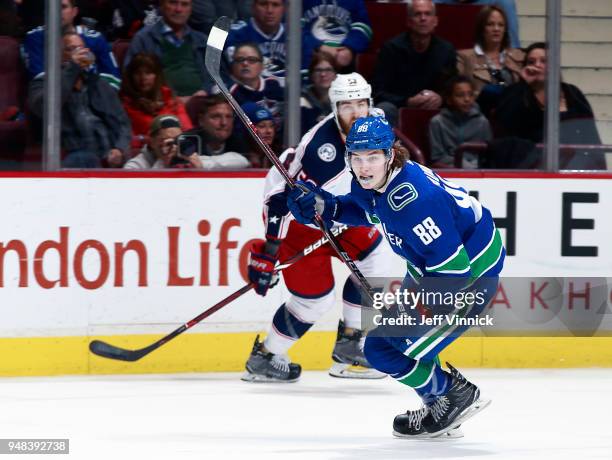 Adam Gaudette of the Vancouver Canucks and David Savard of the Columbus Blue Jackets skate up ice during their NHL game at Rogers Arena March 31,...