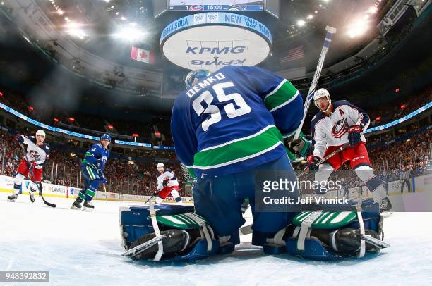 Thatcher Demko of the Vancouver Canucks makes a save off the shot of Seth Jones of the Columbus Blue Jackets during their NHL game at Rogers Arena...