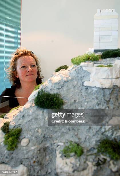 Artist Rachel Whiteread poses next to a model of her shortlised proposal, which she referred to as 'Recycled Mountain' at Ebbsfleet International...