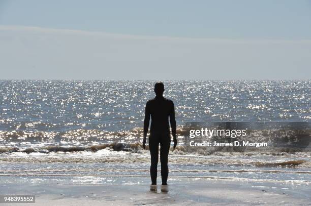 Sculptures from Another Place by Anthony Gormley at Crosby Beach on May 24, 2016 in Liverpool, England. The one hundred cast-iron life-size figures...