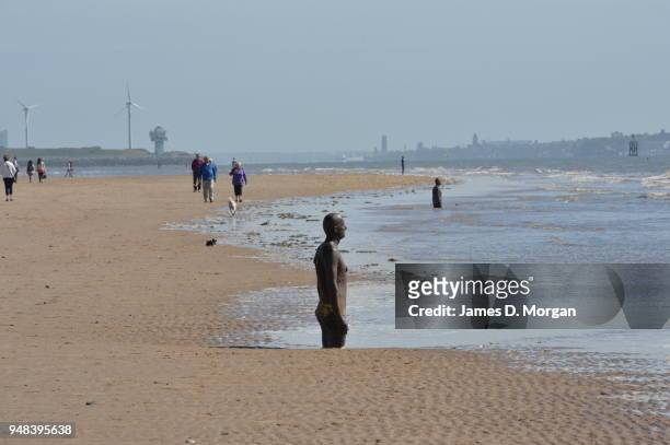 Sculptures from Another Place by Anthony Gormley at Crosby Beach on May 24, 2016 in Liverpool, England. The one hundred cast-iron life-size figures...