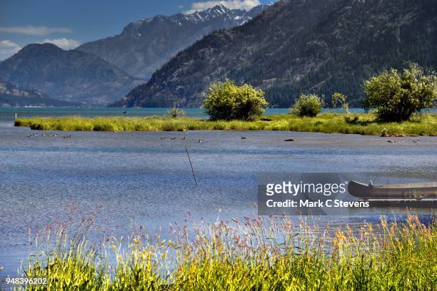 a canoe, ducks, a lake and a mountain backdrop - castle rock colorado stock pictures, royalty-free photos & images