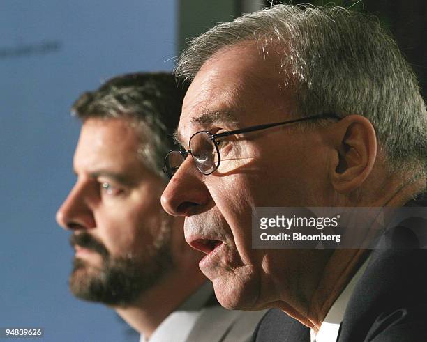 Paul M. Tellier, right, president and CEO, Bombardier Inc., speaks at a press conference in Toronto, March 17, 2004. Seen at left is CFO, Pierre...