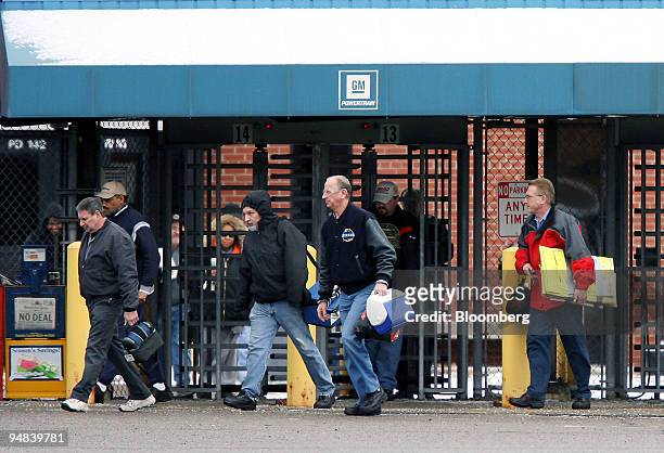 Workers exit the General Motors Powertrain Plant in Warren, Michigan, U.S., on Friday, Dec. 12, 2008. General Motors Corp. And Chrysler LLC, draining...