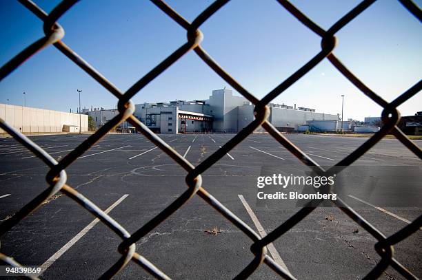 The General Motors Assembly Plant stands beyond a fence in Doraville, Georgia, U.S., on Dec. 12, 2008. The plant was closed in Sept. 2008 as part of...
