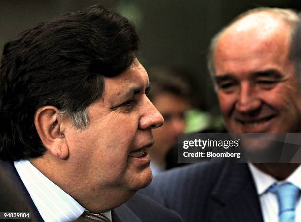 Alan Garcia, Peru's president, left, speaks during a news conference next to Jose Garcia Belaunde, Peru's foreign minister, following the Fifth...