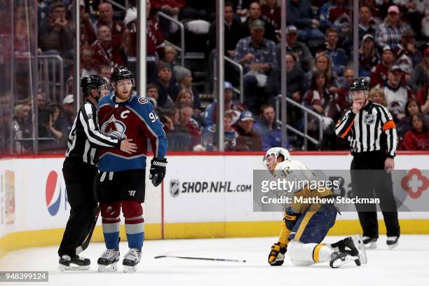 Gabriel Landeskog of the Colorado Avalanche takes out Ryan Johansen of the Nashville Predators in Game Four of the Western Conference First Round...