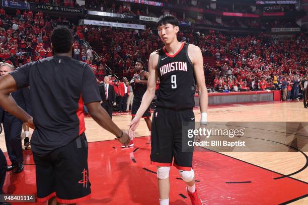 Zhou Qi of the Houston Rockets celebrates with James Harden after the game with the Minnesota Timberwolves after Game Two of Round One of the 2018...