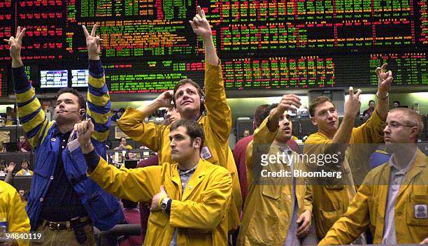 Traders work in the Eurodollar pit of the Chicago Mercantile Exchange in Chicago, Illinois during the announcement that the benchmark U.S. Interest...