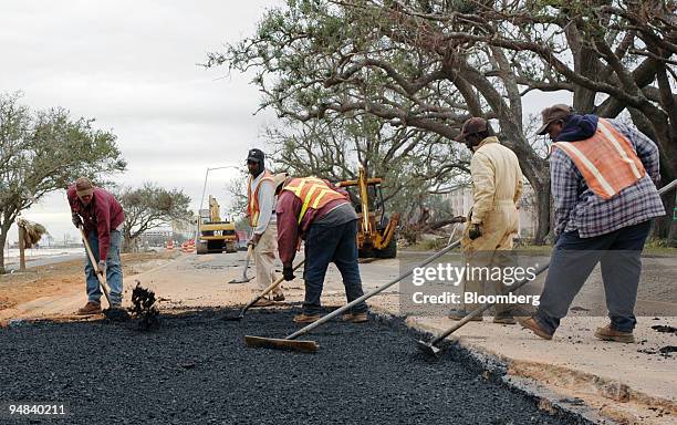 Employees of Mallette Brothers Construction Company of Gautier, Mississippi repave parts of US Hwy. 90 in Gulfport, Mississippi on Friday, December...