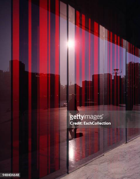 colorful glass facade of building reflecting city life - vertical line stock pictures, royalty-free photos & images