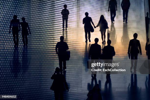 multiple exposure image of people walking in city - crowd in silhouette stock pictures, royalty-free photos & images