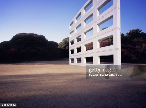 concrete skeleton wall in the middle of urban park - art installation stock pictures, royalty-free photos & images