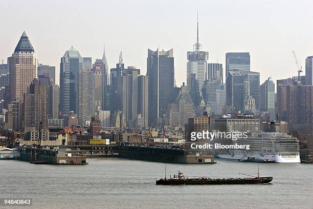 Barge travels past the New York Passenger Ship Terminal on the bank of the Hudson River in New York, Thursday, February 23, 2006. U.S. Senators from...