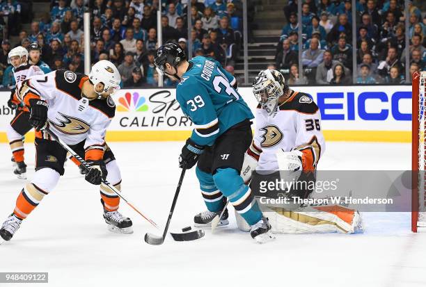 Goalie John Gibson and Andrew Cogliano of the Anaheim Ducks defend the goal against Logan Couture of the San Jose Sharks during the second period in...