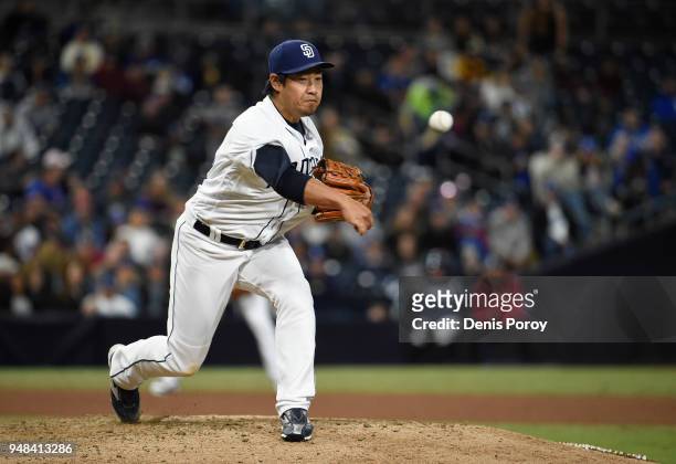 Kazuhisa Makita of the San Diego Padres throws back to first base during the seventh inning of a baseball game against the Los Angeles Dodgers at...