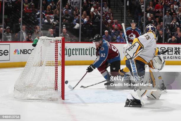 Gabriel Landeskog of the Colorado Avalanche scores against goaltender Pekka Rinne of the Nashville Predators in Game Four of the Western Conference...