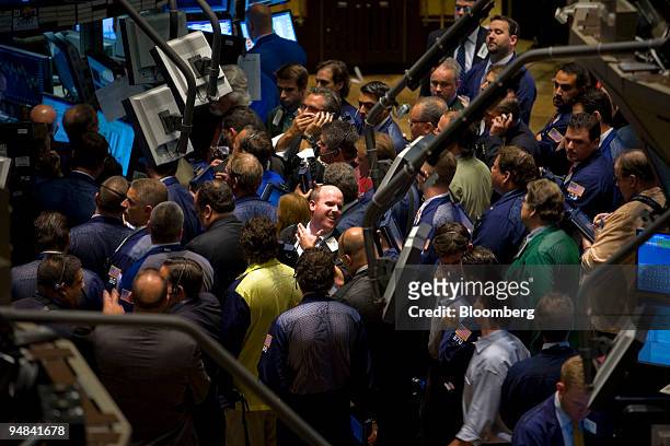 Traders work on the floor of the New York Stock Exchange in New York, U.S., at the end of the trading day on Friday, Sept. 26, 2008. U.S. Stocks...