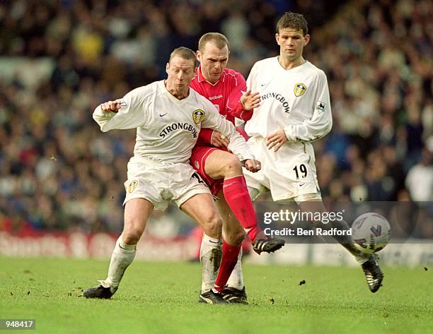 Danny Murphy of Liverpool is squeezed out by David Batty and Eirik Bakke of Leeds United during the FA Cup Fourth Round match at Elland Road in...