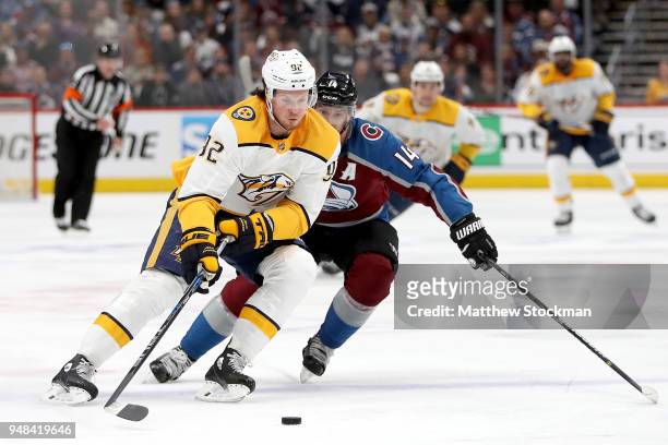 Ryan Johansen of the Nashville Predators advances the puck against Blake Comeau of the Colorado Avalanche in Game Four of the Western Conference...