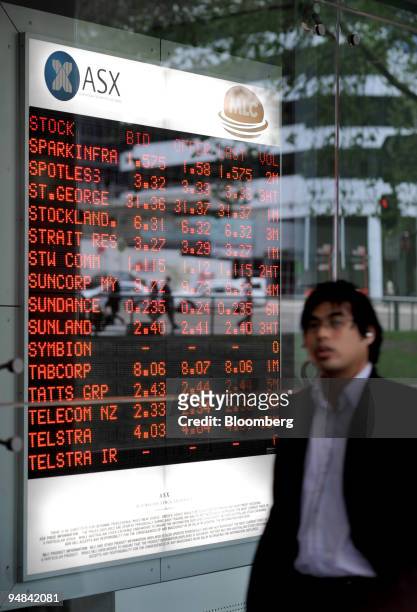 Share prices are seen on an Australian Stock Exchange board in Sydney, Australia, on Tuesday, Sept. 23, 2008. Australian stocks fell for the first...