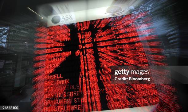 Share prices are seen on an Australian Stock Exchange board in Sydney, Australia, on Tuesday, Sept. 23, 2008. Australian stocks fell for the first...